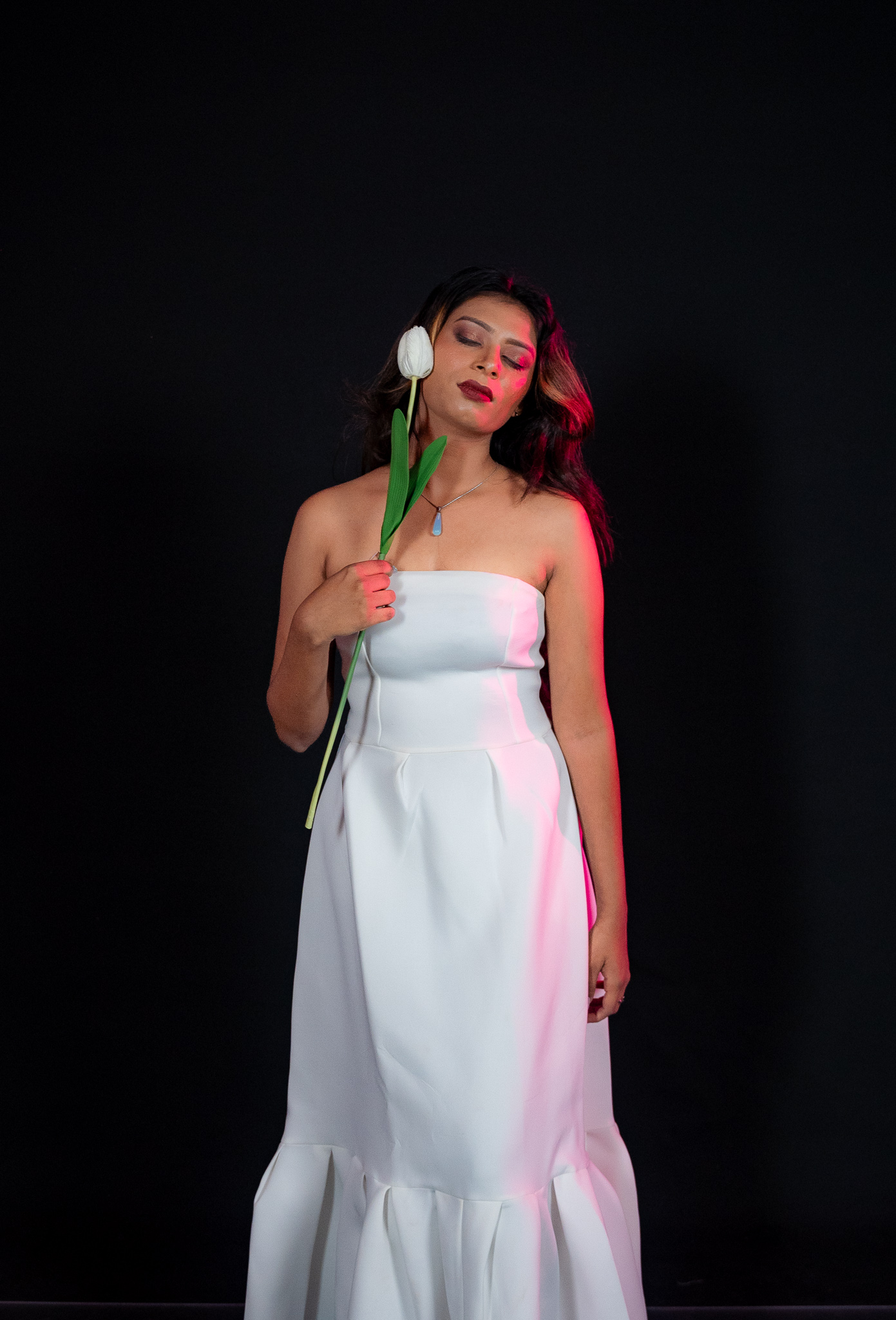 Kawya Erandi — white gown with tulip, eyes closed
